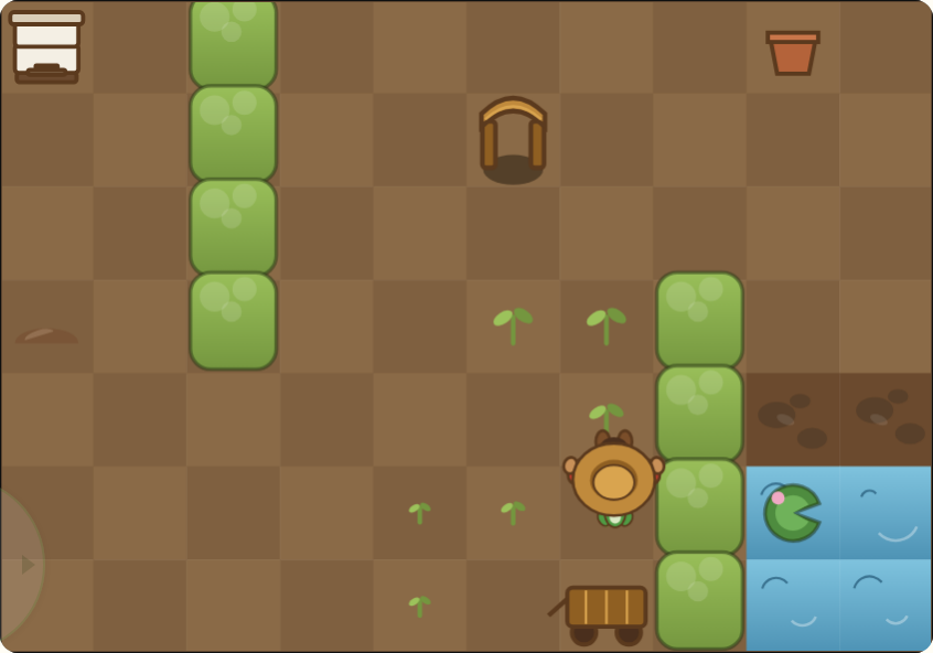 Eden's Garden: a top-down plot of soil with green hedges, young sprouts, a pond with a frog, a wagon, and Eden standing mid-row.